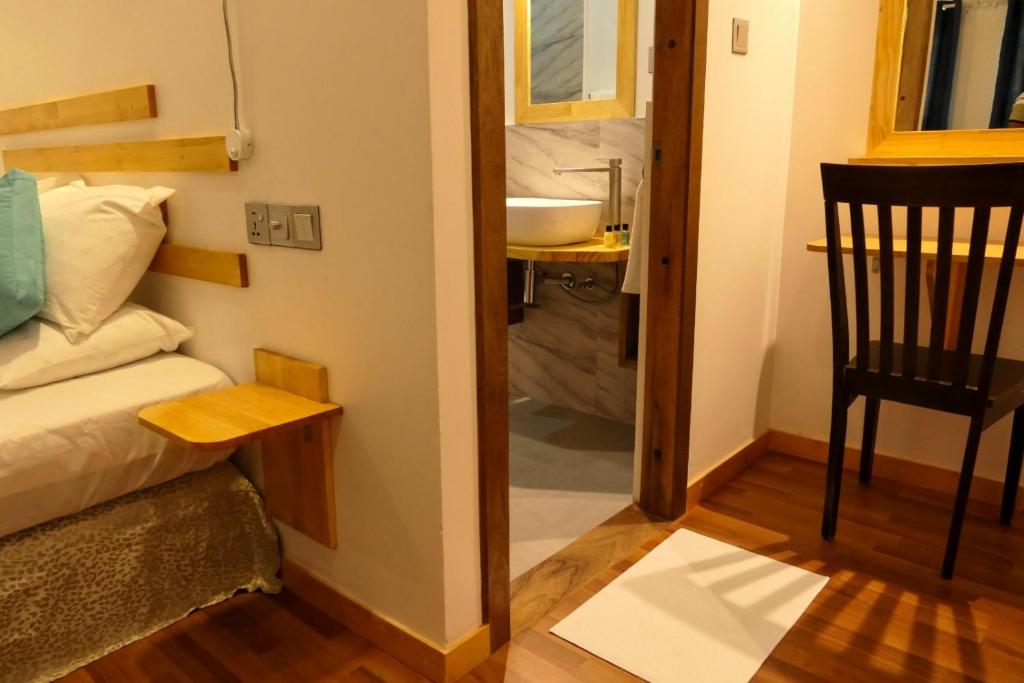 Postel nebo postele na pokoji v ubytování AYIRA Maldives