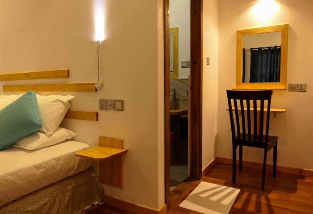 Postel nebo postele na pokoji v ubytování AYIRA Maldives
