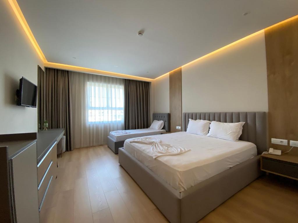 Postel nebo postele na pokoji v ubytování Hotel Colis
