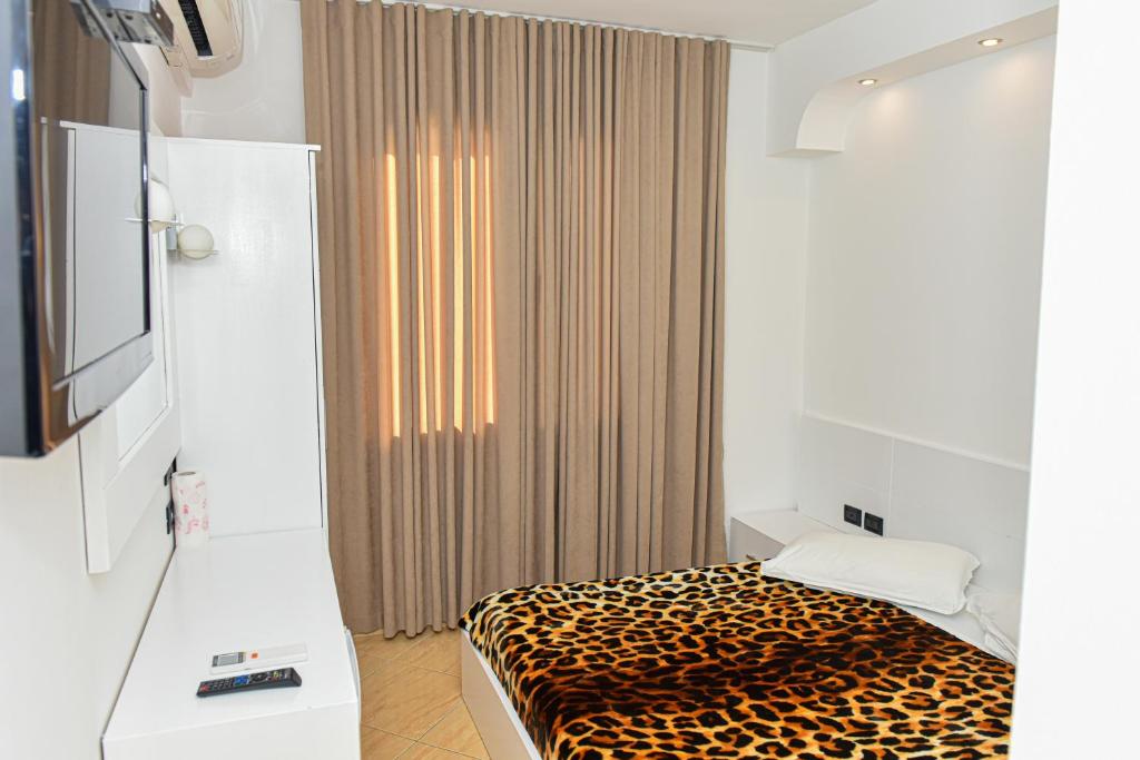 Postel nebo postele na pokoji v ubytování Hotel Tomorri