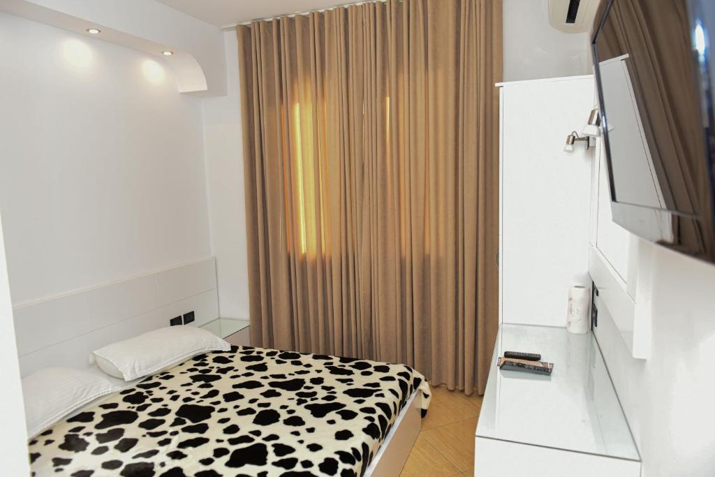 Postel nebo postele na pokoji v ubytování Hotel Tomorri