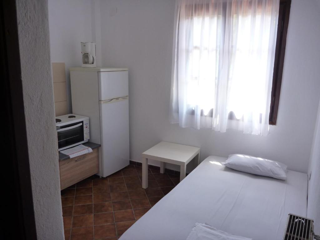 Cuisine ou kitchenette dans l'établissement La Mirage