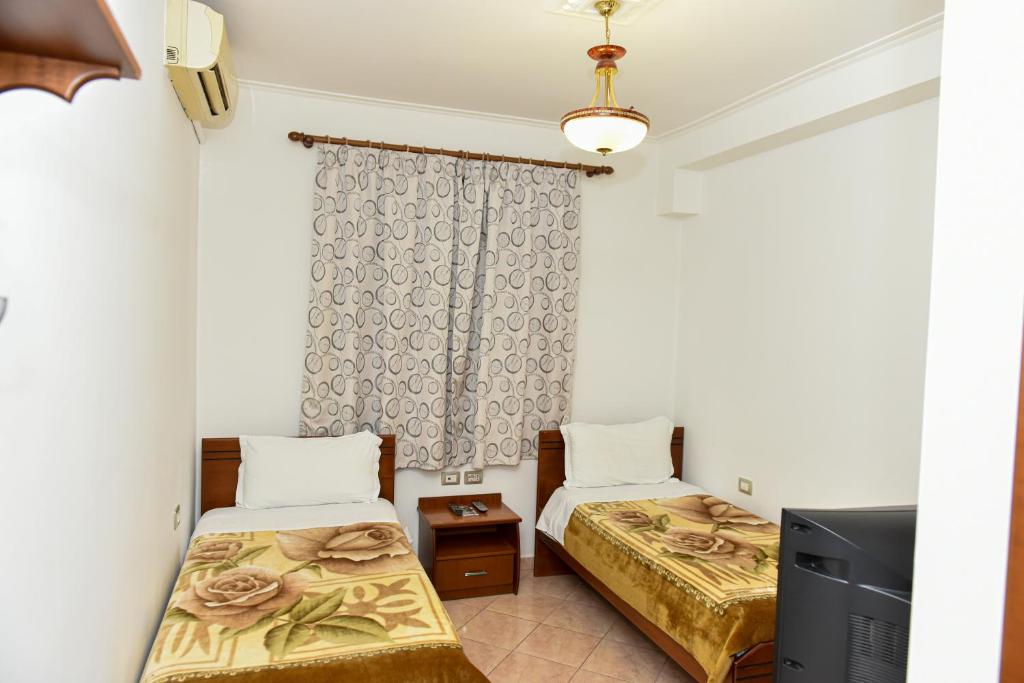 Postel nebo postele na pokoji v ubytování Hotel Tomorri