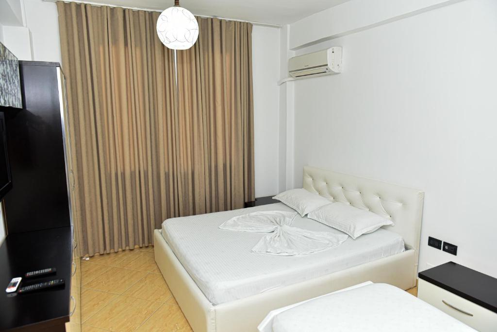 Postel nebo postele na pokoji v ubytování Hotel Tomorri