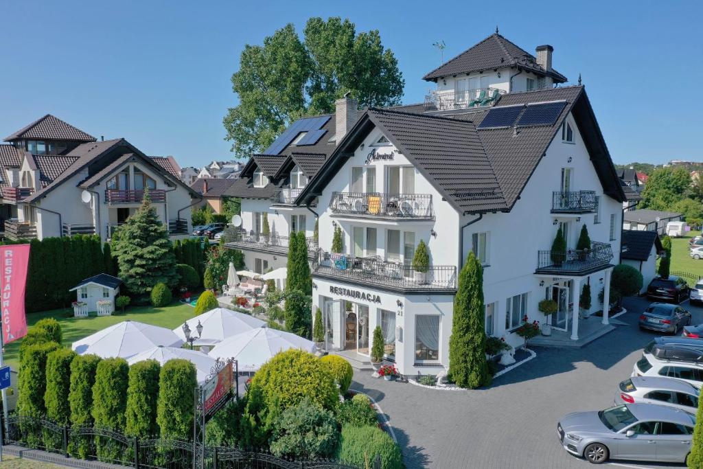 a rendering of a house with cars parked in a parking lot at Pensjonat & Restauracja Admirał in Jastarnia