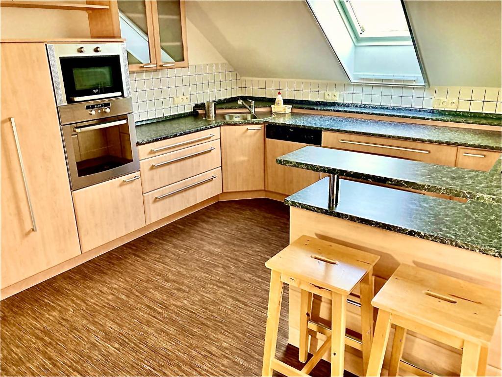 Kuchyň nebo kuchyňský kout v ubytování Apartmány Vojta