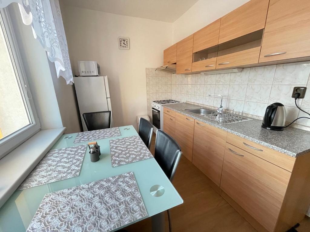 Kuchyň nebo kuchyňský kout v ubytování Apartman JnJ Velkomoravska