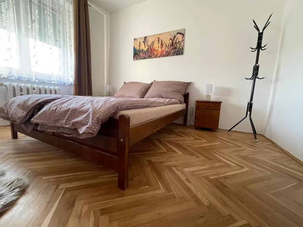 Postel nebo postele na pokoji v ubytování Apartman JnJ Velkomoravska