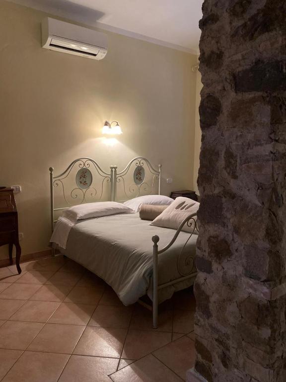 A bed or beds in a room at Affittacamere La Torre di Montalcino