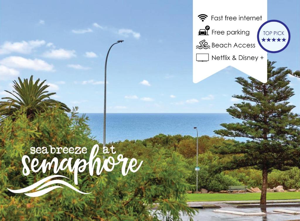 a sign that says sea breezes at semaphore with a tree at Seabreeze at Semaphore #8 - On the Esplanade in Semaphore