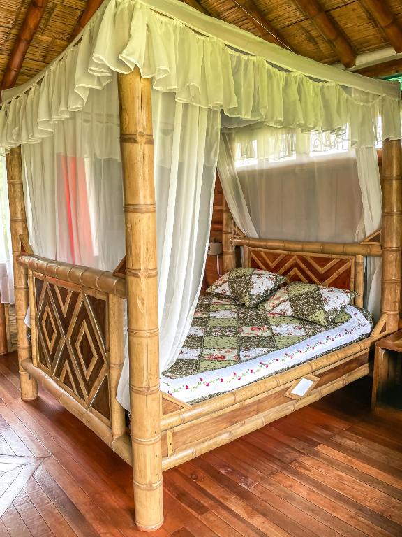 Voodi või voodid majutusasutuse Cabaña Numbana San Agustín toas