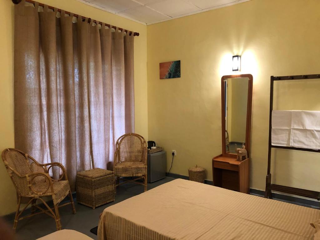 Postel nebo postele na pokoji v ubytování Wilpattu Wildhideaway