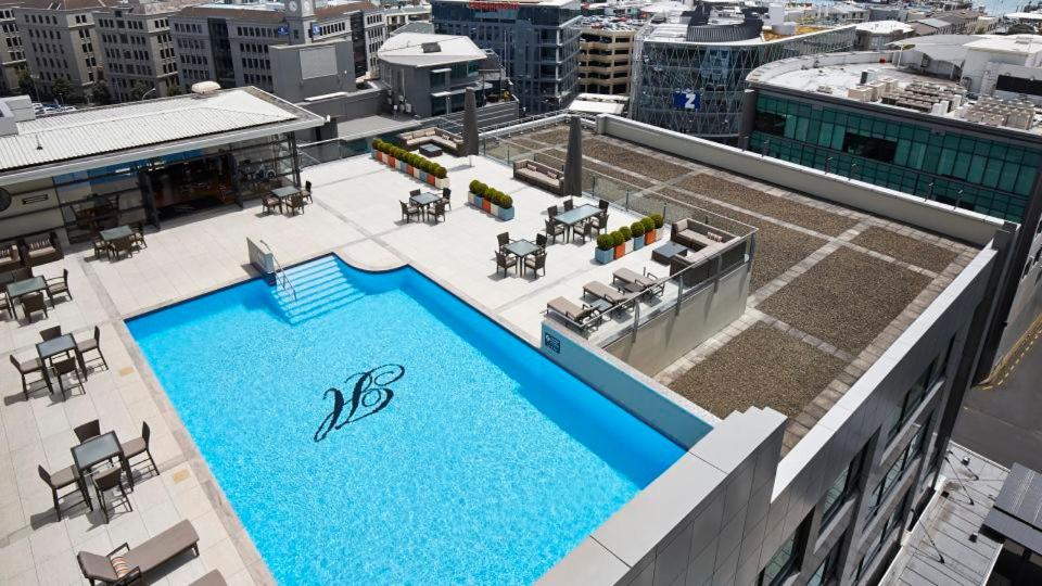 an overhead view of a swimming pool on top of a building at Heritage towers Apartment in Auckland