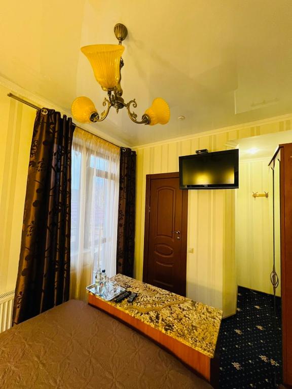 Postel nebo postele na pokoji v ubytování Hotel Afrodita