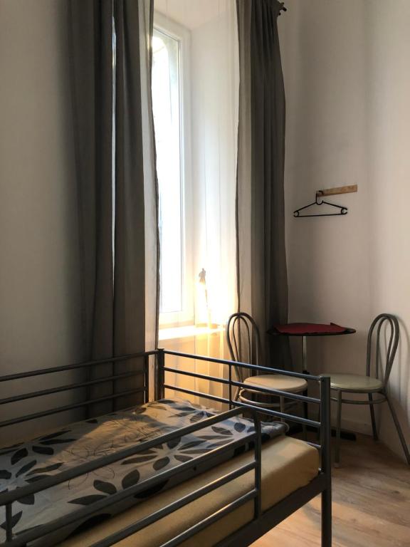 En eller flere senge i et værelse på Caramba