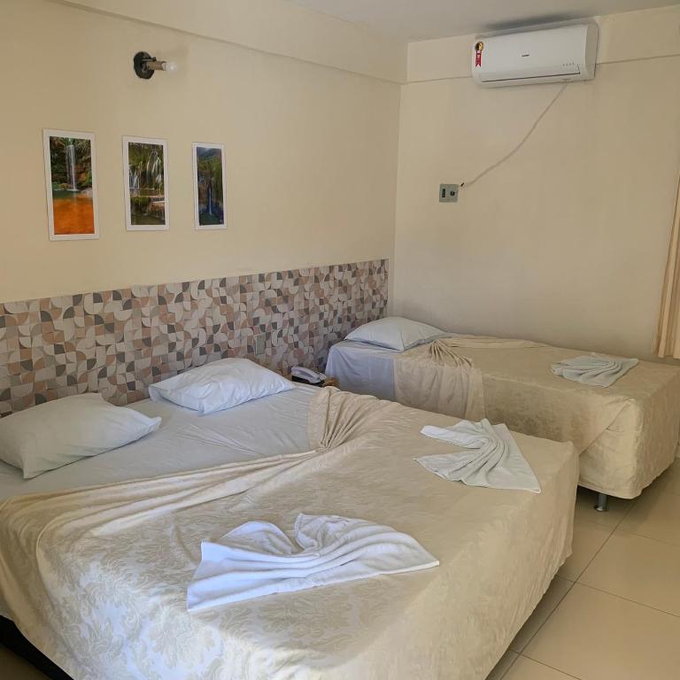 Postel nebo postele na pokoji v ubytování CALDAS PALACE HOTEL JORRO