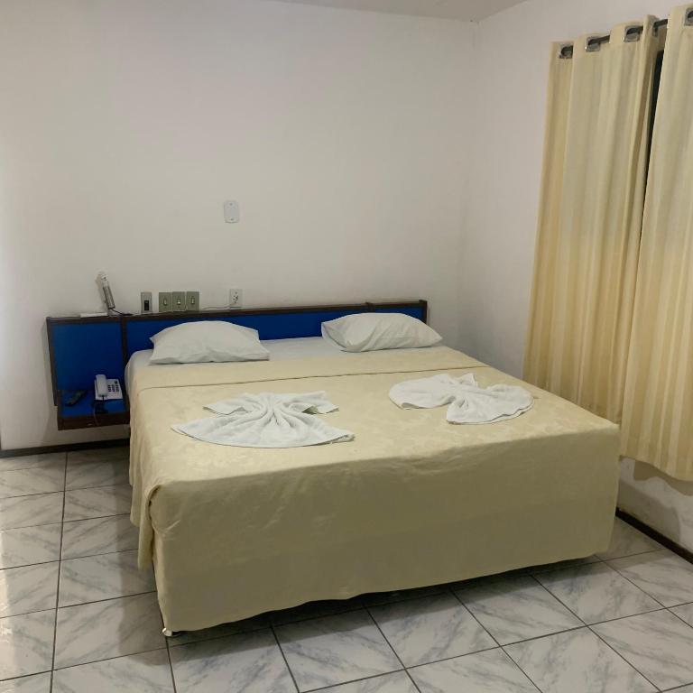 Postel nebo postele na pokoji v ubytování CALDAS PALACE HOTEL JORRO