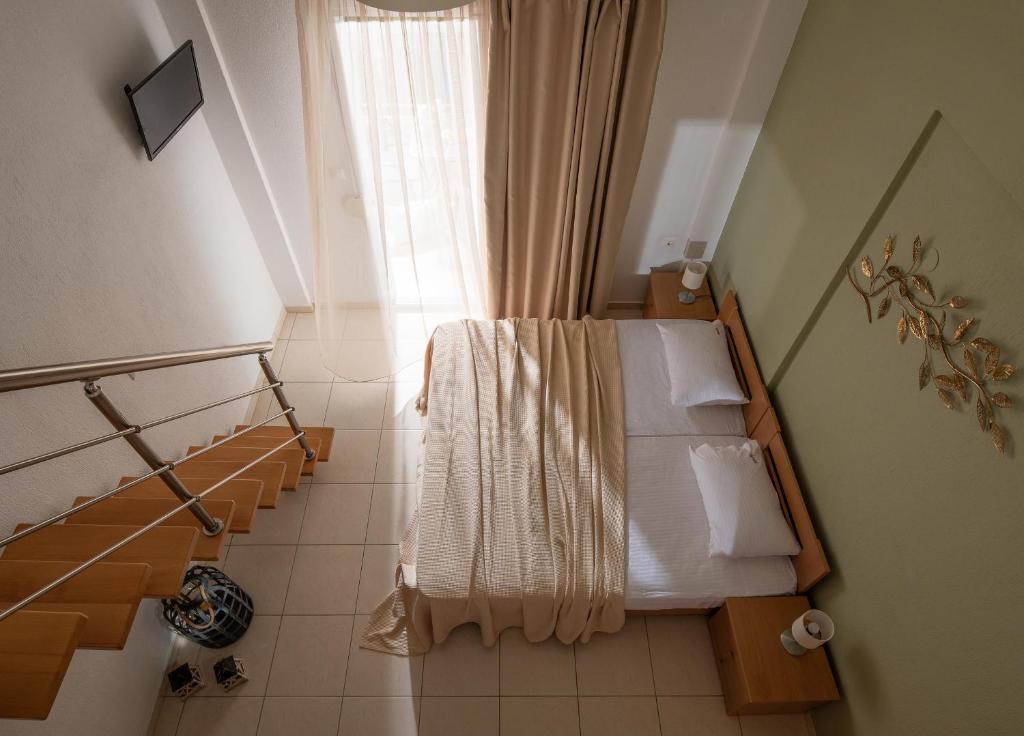 Postel nebo postele na pokoji v ubytování Agrelia studios