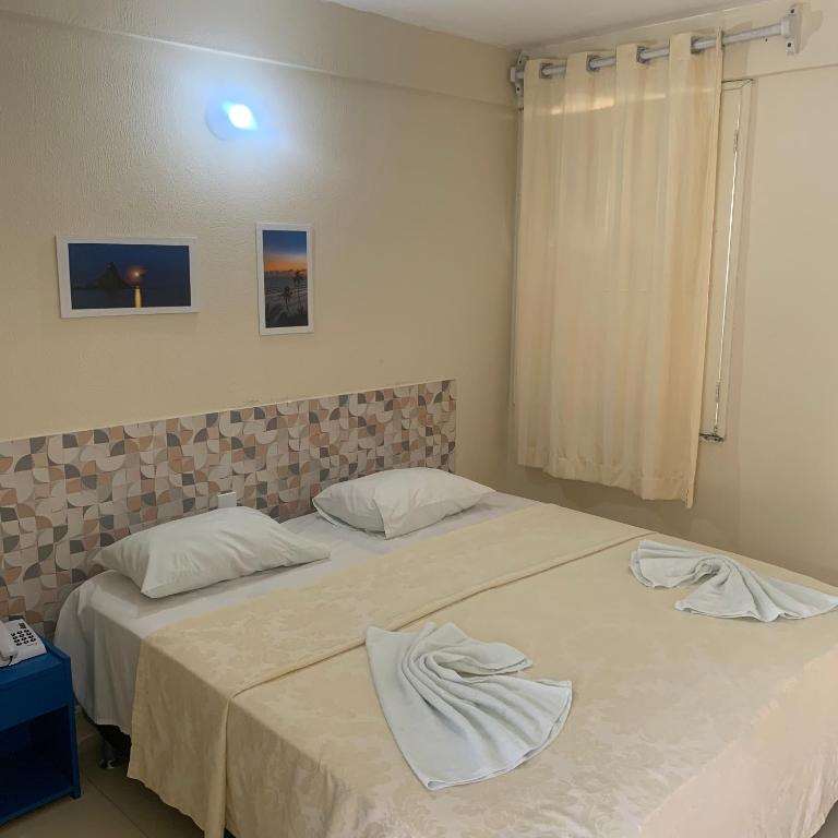 Postel nebo postele na pokoji v ubytování CALDAS PALACE HOTEL JORRO