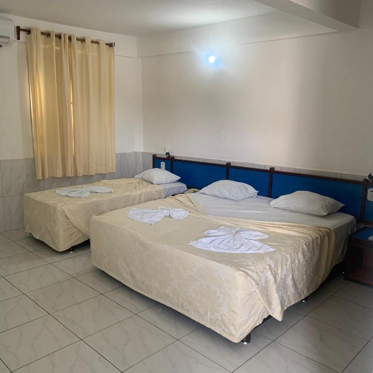 Postel nebo postele na pokoji v ubytování CALDAS PALACE HOTEL JORRO