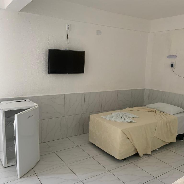 Postel nebo postele na pokoji v ubytování CALDAS PALACE HOTEL JORRO