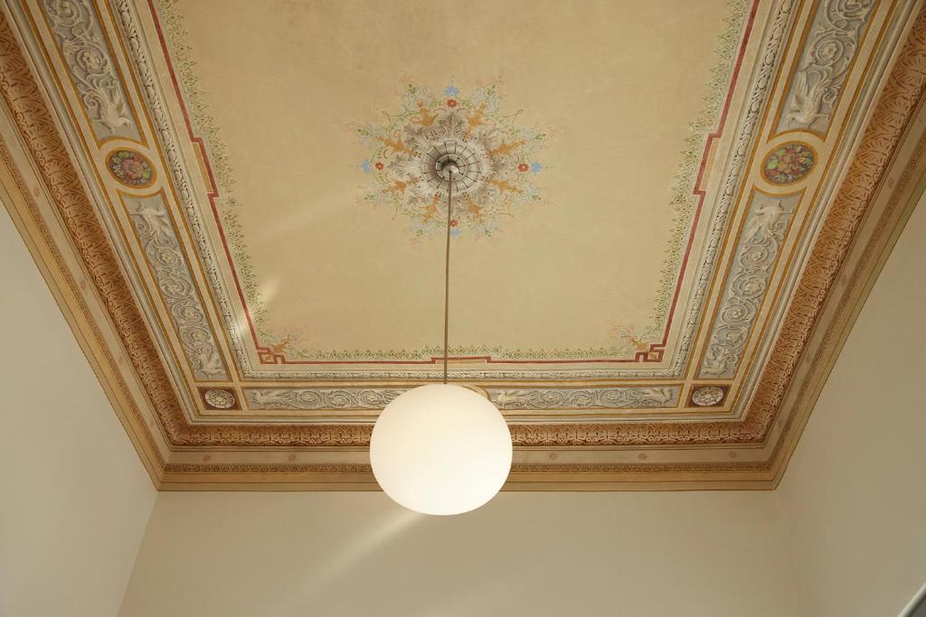 a ceiling with a chandelier in a room at Del Taso 1850 in Athens