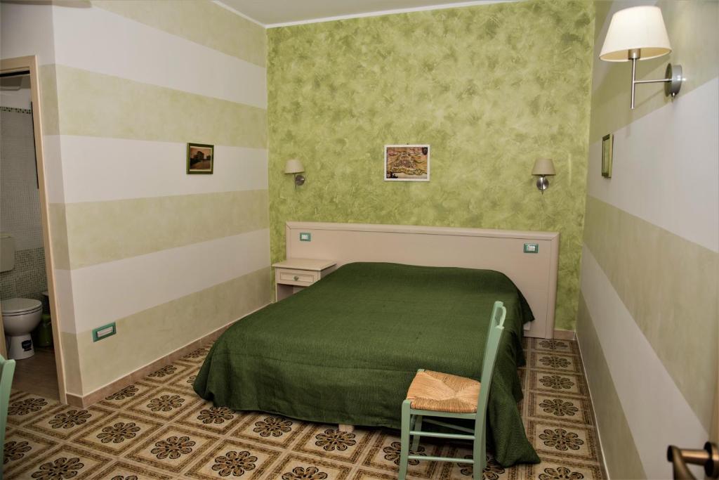 Postel nebo postele na pokoji v ubytování La Lanterna Di BaChi