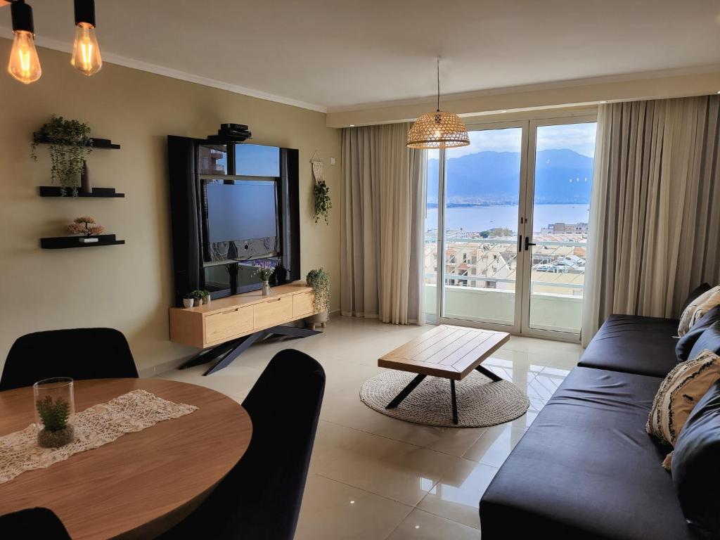 a living room with a couch and a table at Milano Suite in Lev Eilat in Eilat