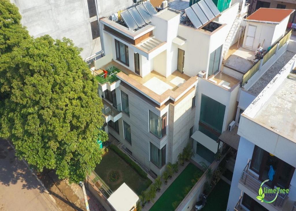 an overhead view of a building with a tree at Lime Tree Sector 29 Gurgaon Sushant Lok at Iffco Metro in Gurgaon