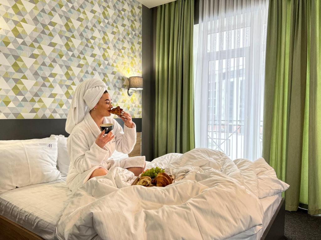 Postel nebo postele na pokoji v ubytování Arena Apart - Hotel
