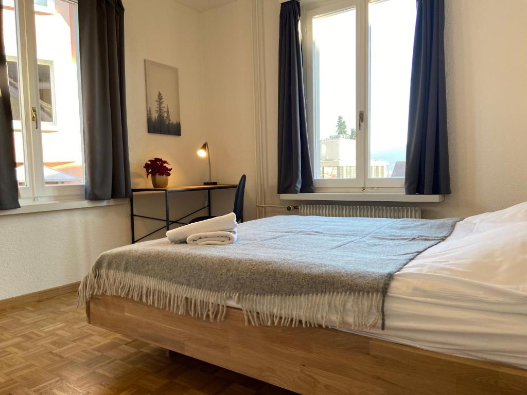 Katil atau katil-katil dalam bilik di Swiss Stay - 2 Bedroom Apartment close to ETH Zurich