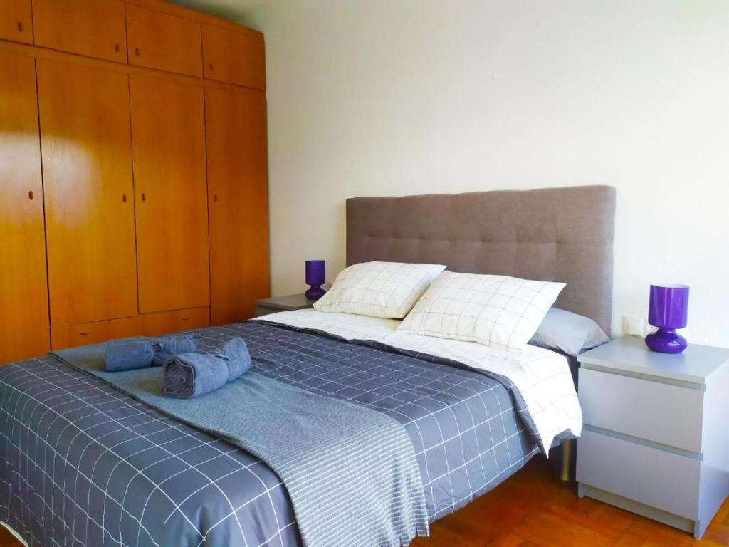 Llit o llits en una habitació de Apartamento en el centro de Laredo Menendez Pelayo 17