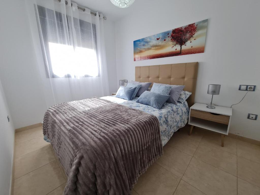 Posteľ alebo postele v izbe v ubytovaní Sybarix Apartment: Precioso apartamento con vistas al golf y el mar