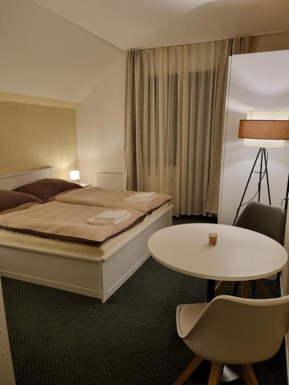 Postel nebo postele na pokoji v ubytování Hotel PlannerInn