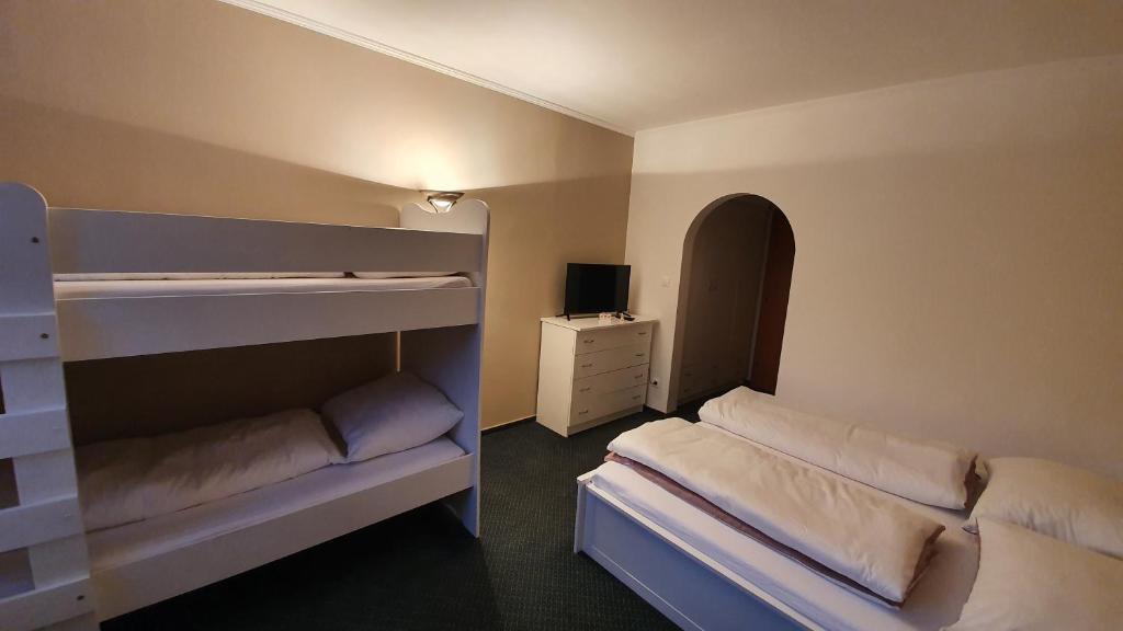 Postel nebo postele na pokoji v ubytování Hotel PlannerInn