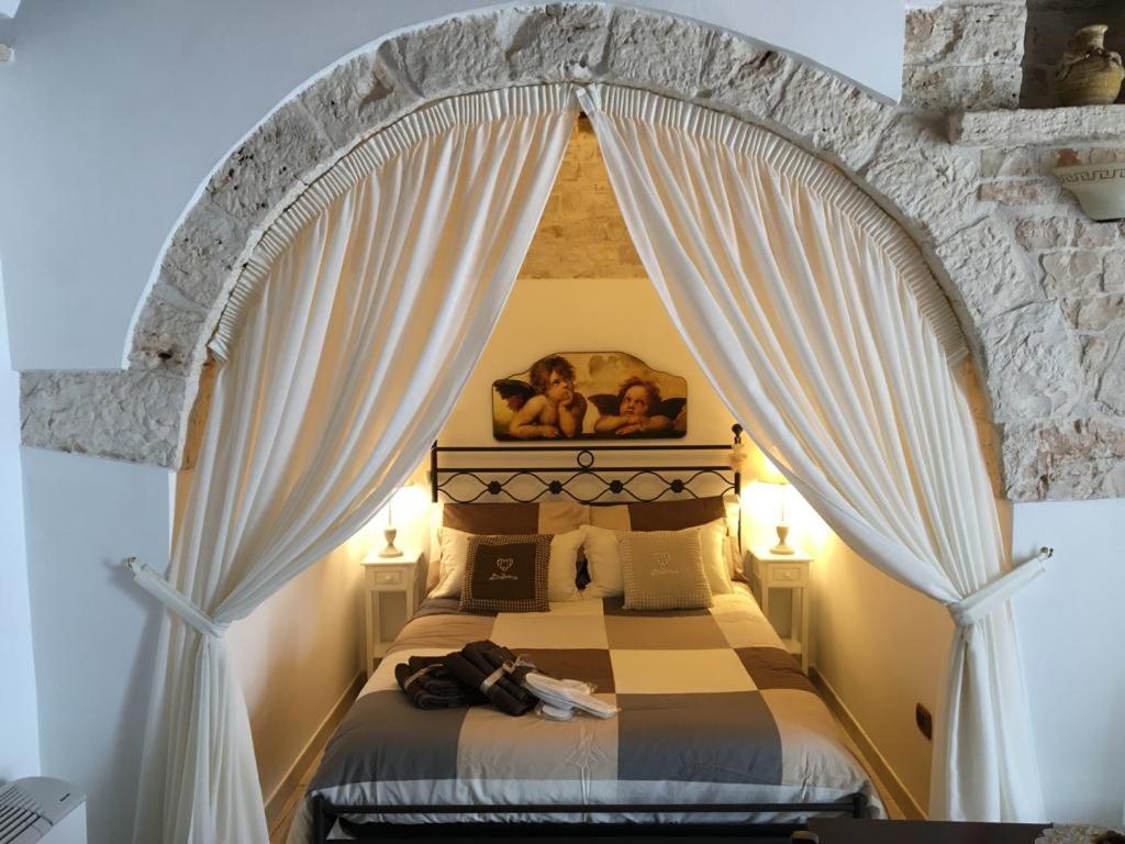 Postel nebo postele na pokoji v ubytování Il Trullo dei Sogni