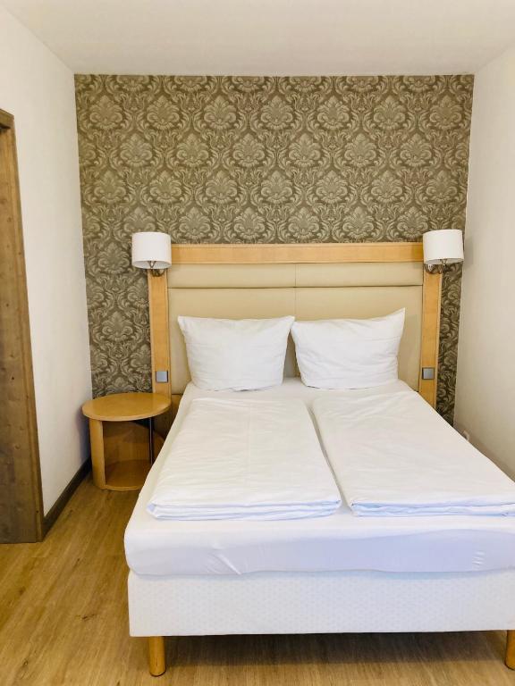 Postel nebo postele na pokoji v ubytování L-DOM