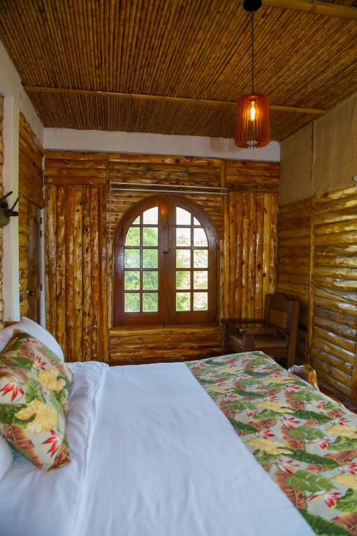 Postel nebo postele na pokoji v ubytování Hacienda Charrascal Coffe Farm