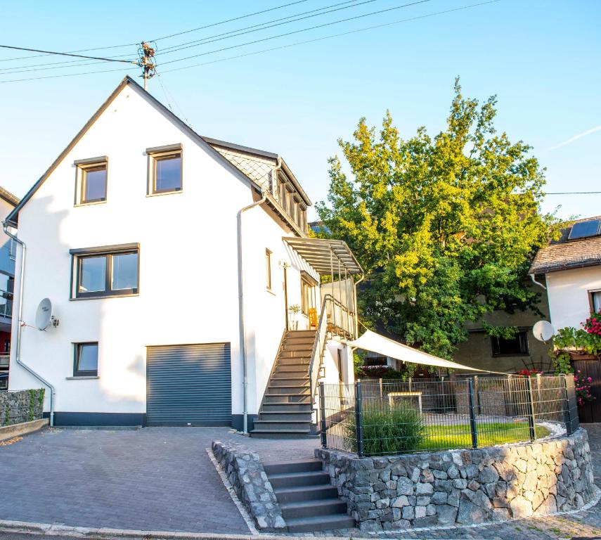 a house with a slide in front of it at Haus Toni in Sankt Goar