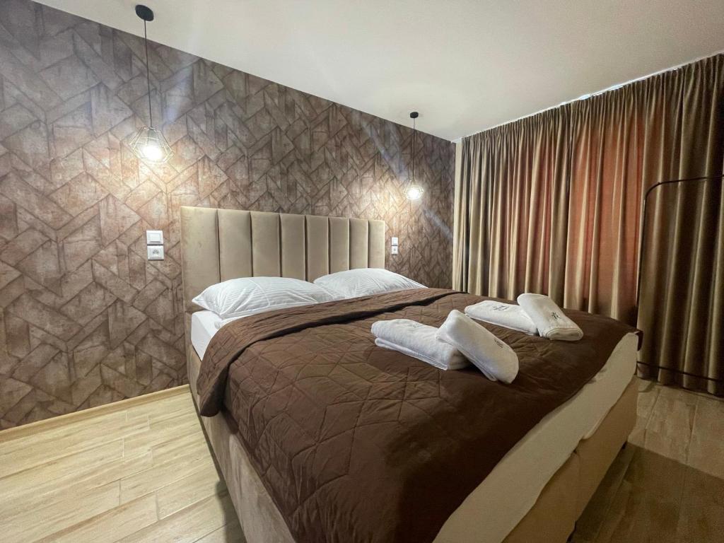 Postel nebo postele na pokoji v ubytování Totina Apartments
