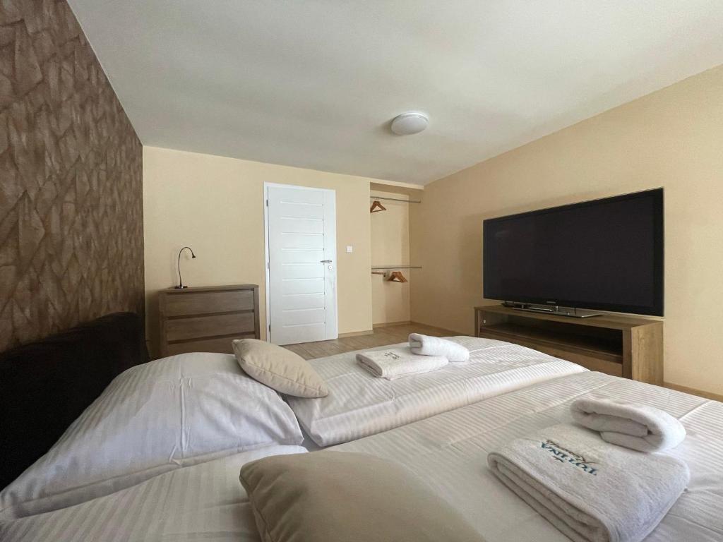 Postel nebo postele na pokoji v ubytování Totina Apartments