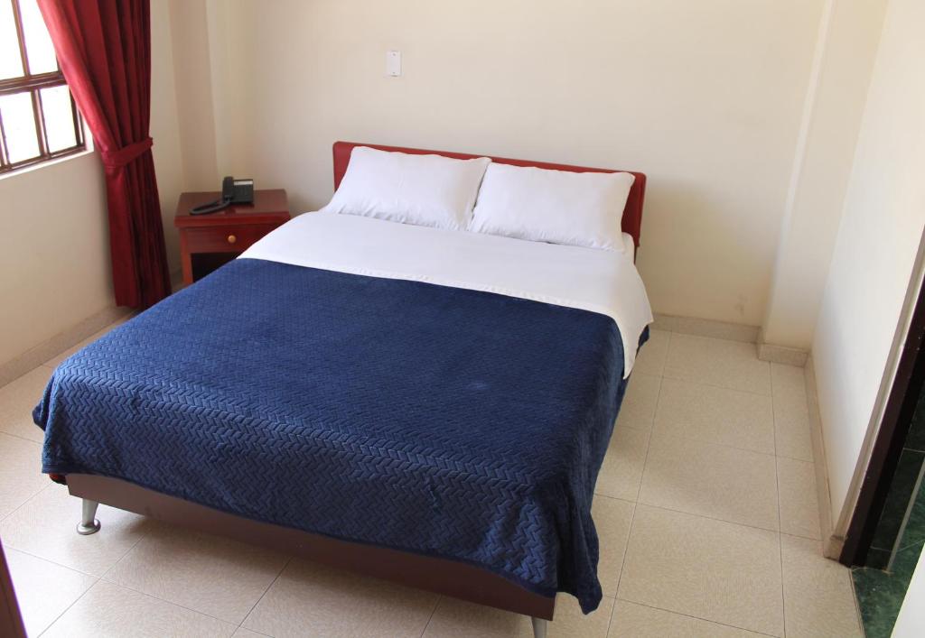 Postel nebo postele na pokoji v ubytování Hotel Vigua