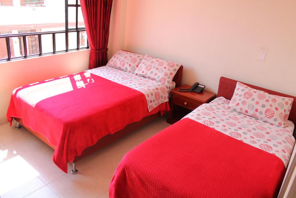 Postel nebo postele na pokoji v ubytování Hotel Vigua