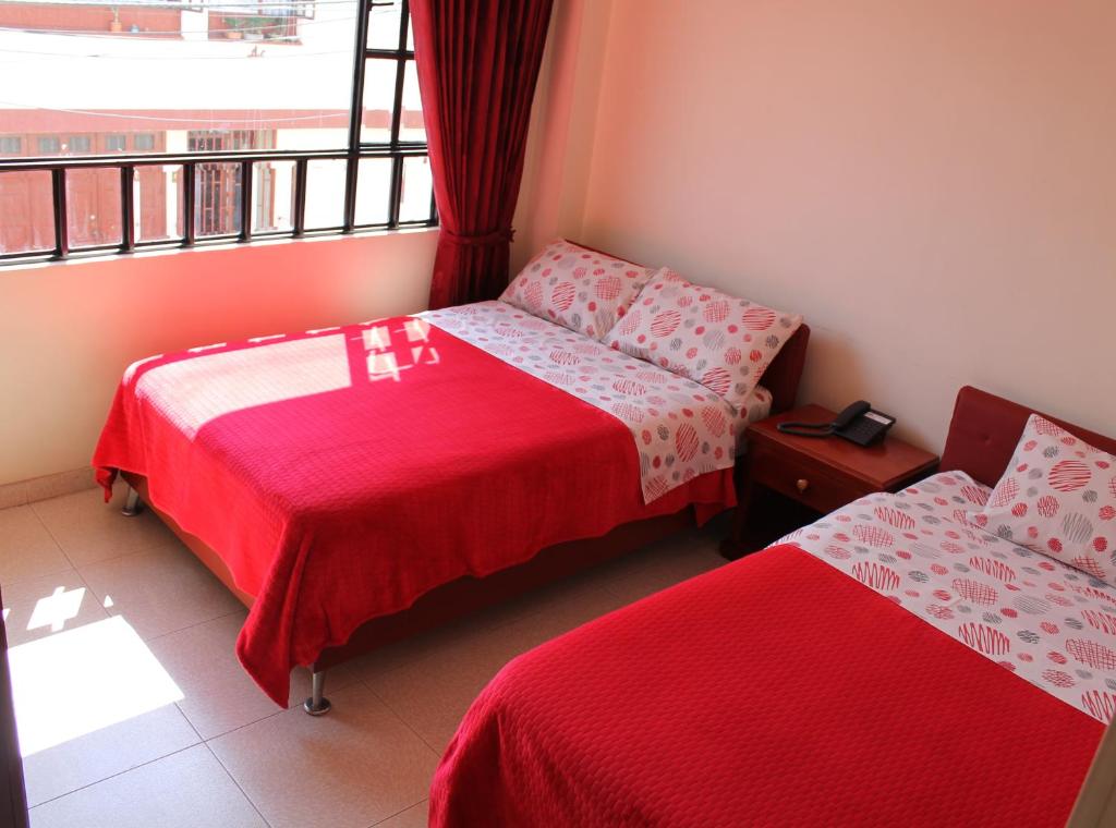 Postel nebo postele na pokoji v ubytování Hotel Vigua
