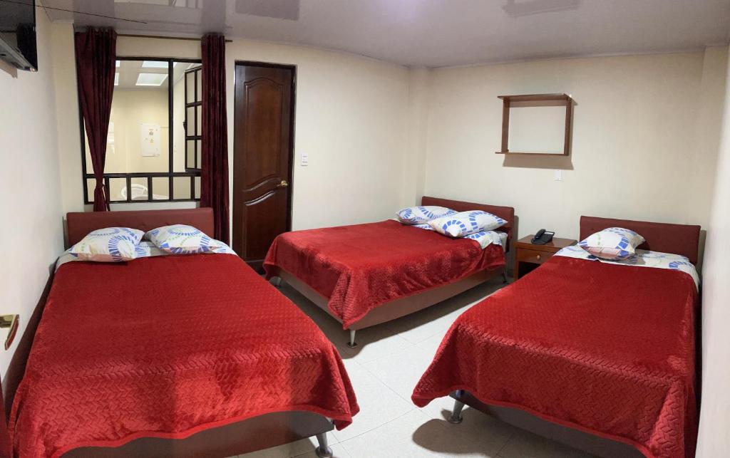 Postel nebo postele na pokoji v ubytování Hotel Vigua
