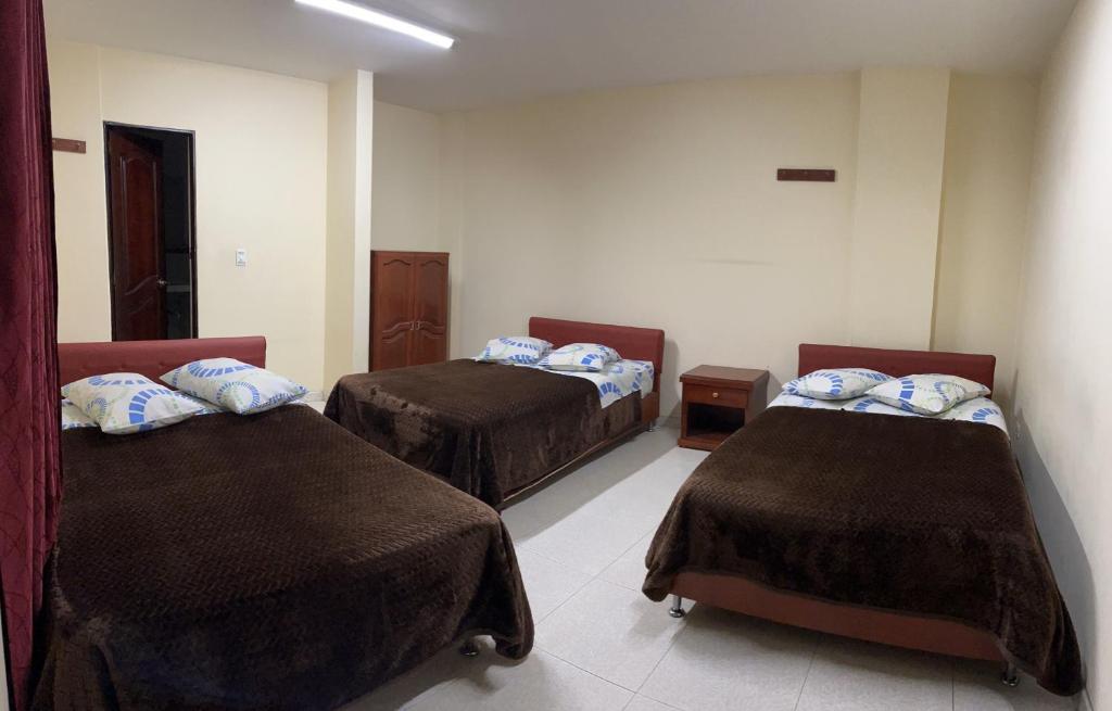 Postel nebo postele na pokoji v ubytování Hotel Vigua