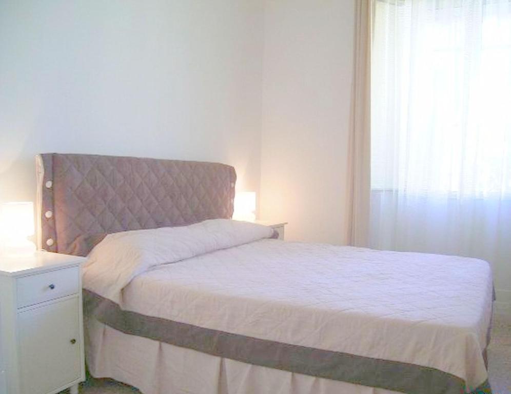 Postel nebo postele na pokoji v ubytování Cathy Apartment