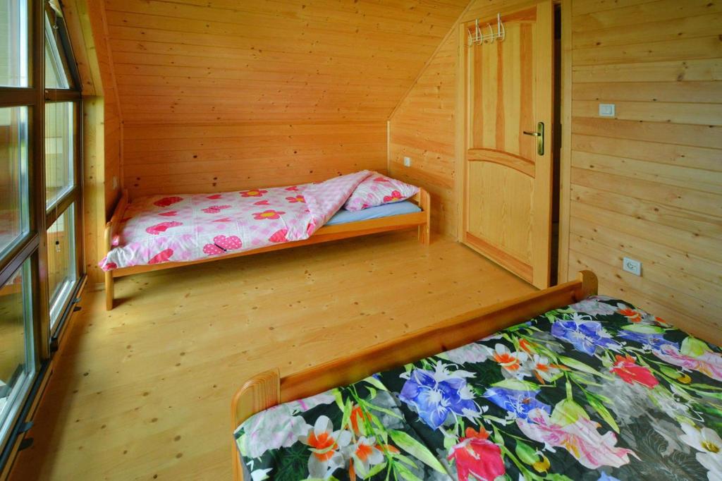 Posteľ alebo postele v izbe v ubytovaní Holiday resort with pool and sauna, Grzybowo