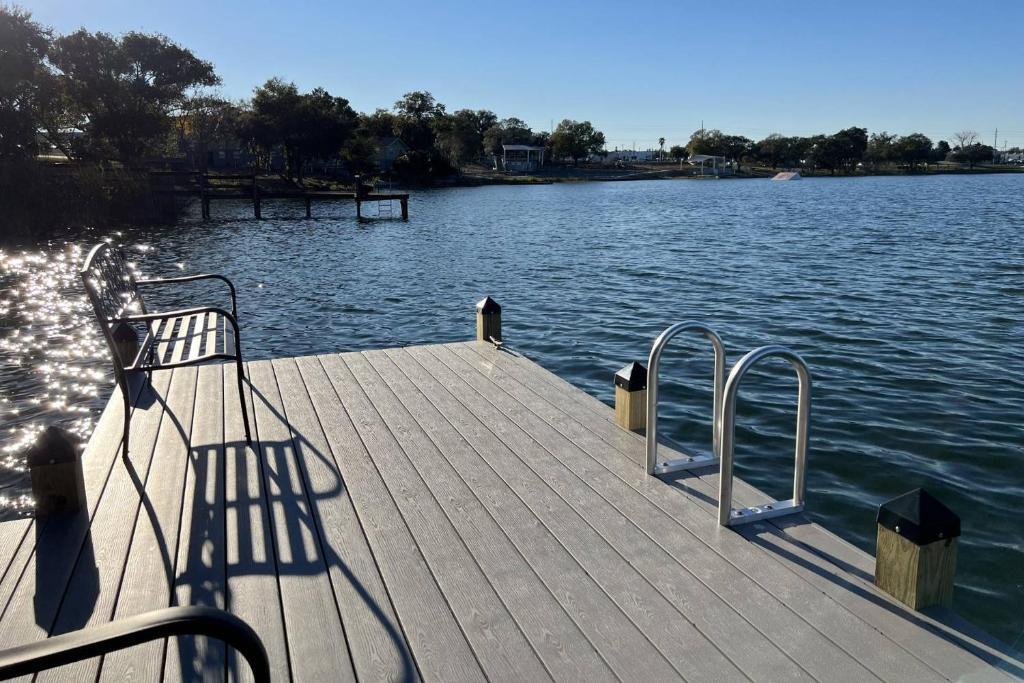a dock on a body of water with a boat at Lake Silver Retreat lll in Winter Haven