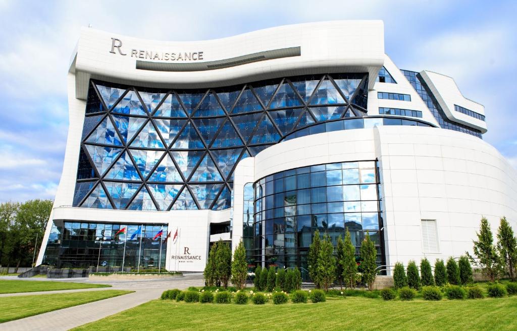 a large white building with a lot of windows at Renaissance Minsk Hotel in Minsk